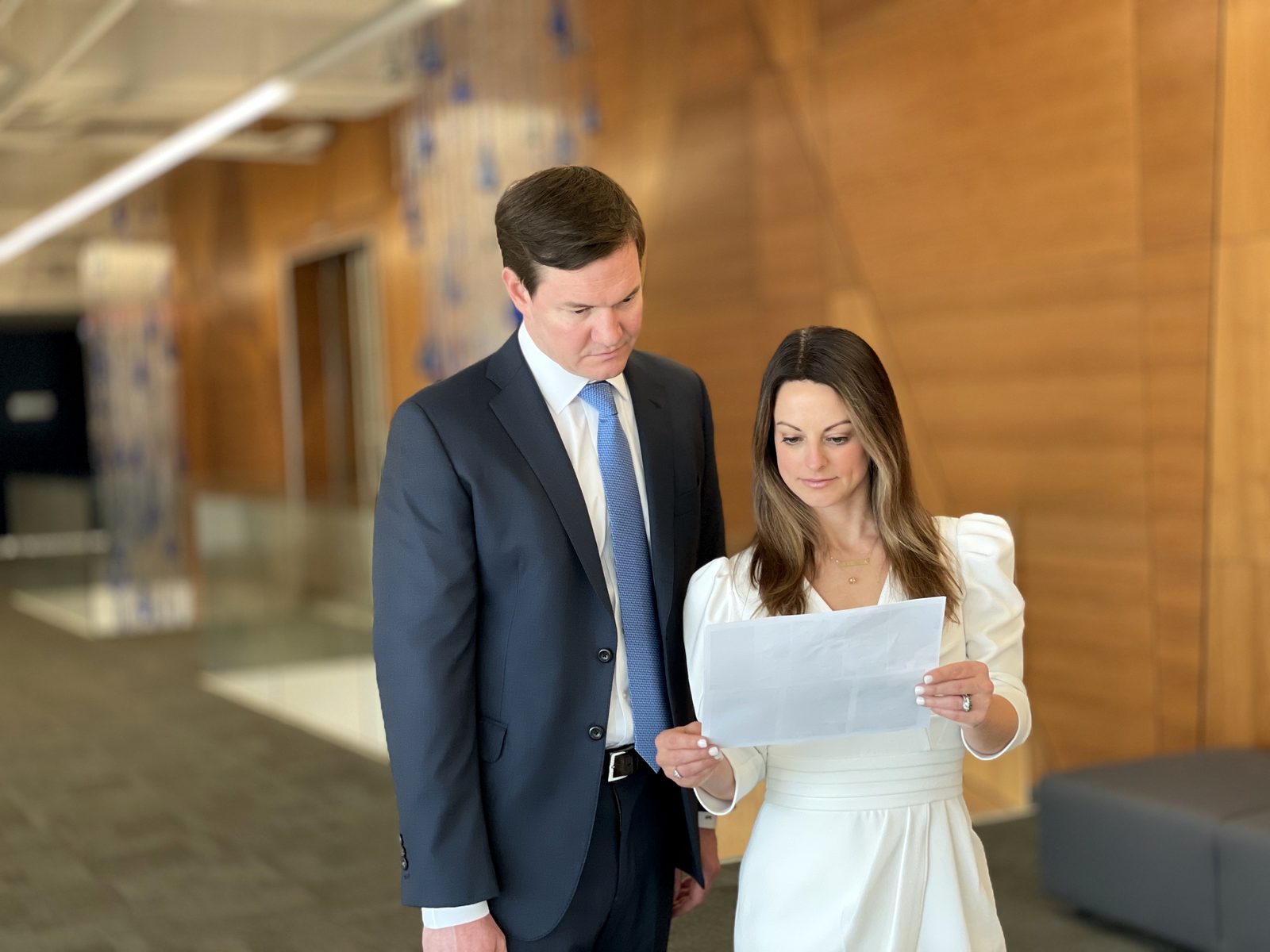 Sloan Ellis and Brandi Hinton reviewing a document